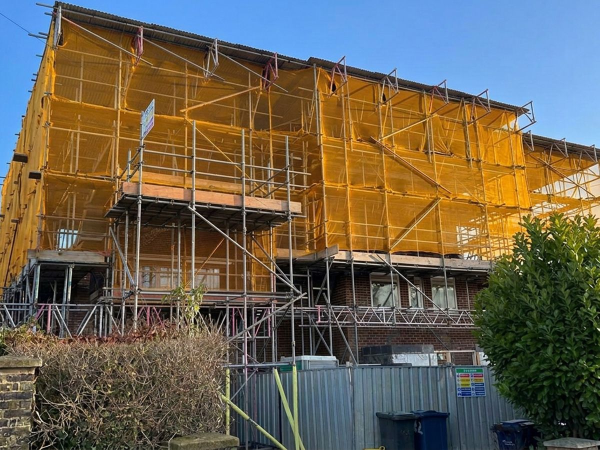 Scaffolding with debris netting on a property in Cambridge